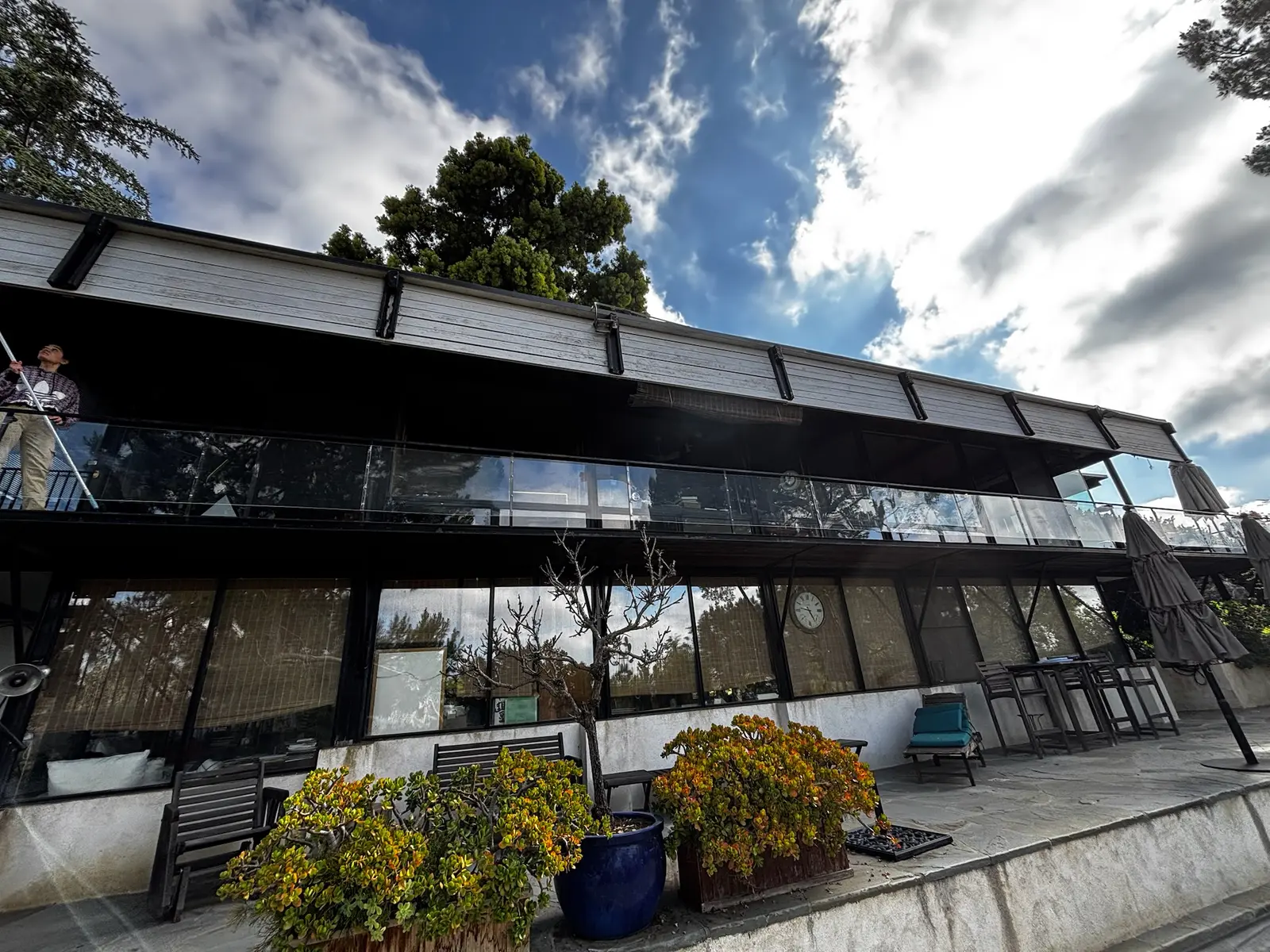 A wall of glass on a mid-century Westside home, cleaned streak-free